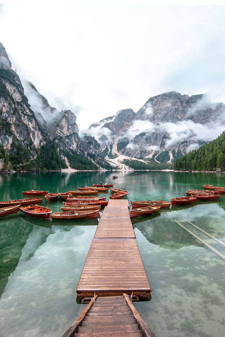 Wooden boats on a peaceful mountain lake